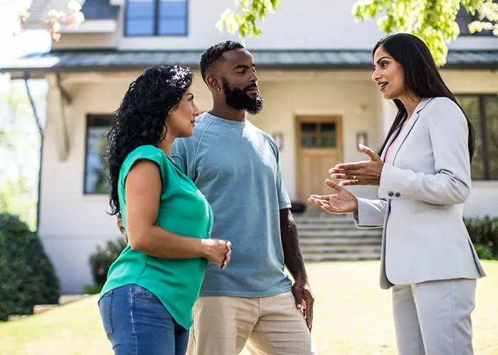 couple meeting with realtor