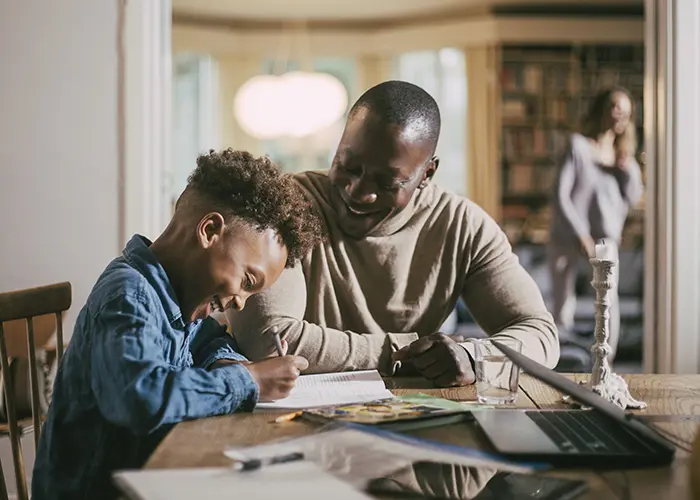 dad with son working on homework