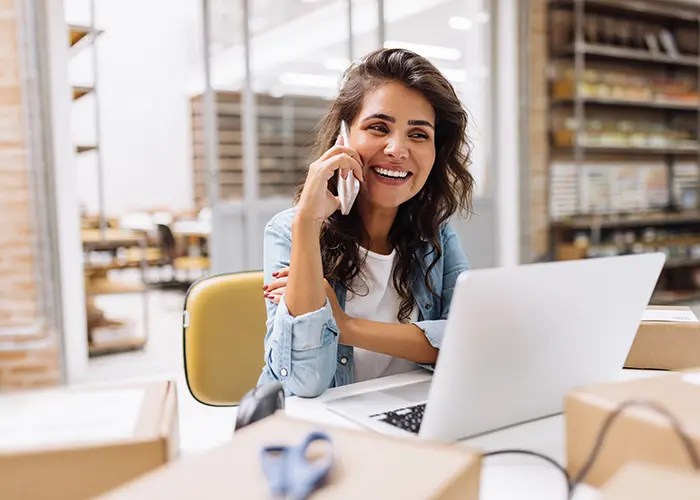 woman on a laptop and phone
