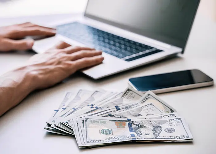 laptop and money