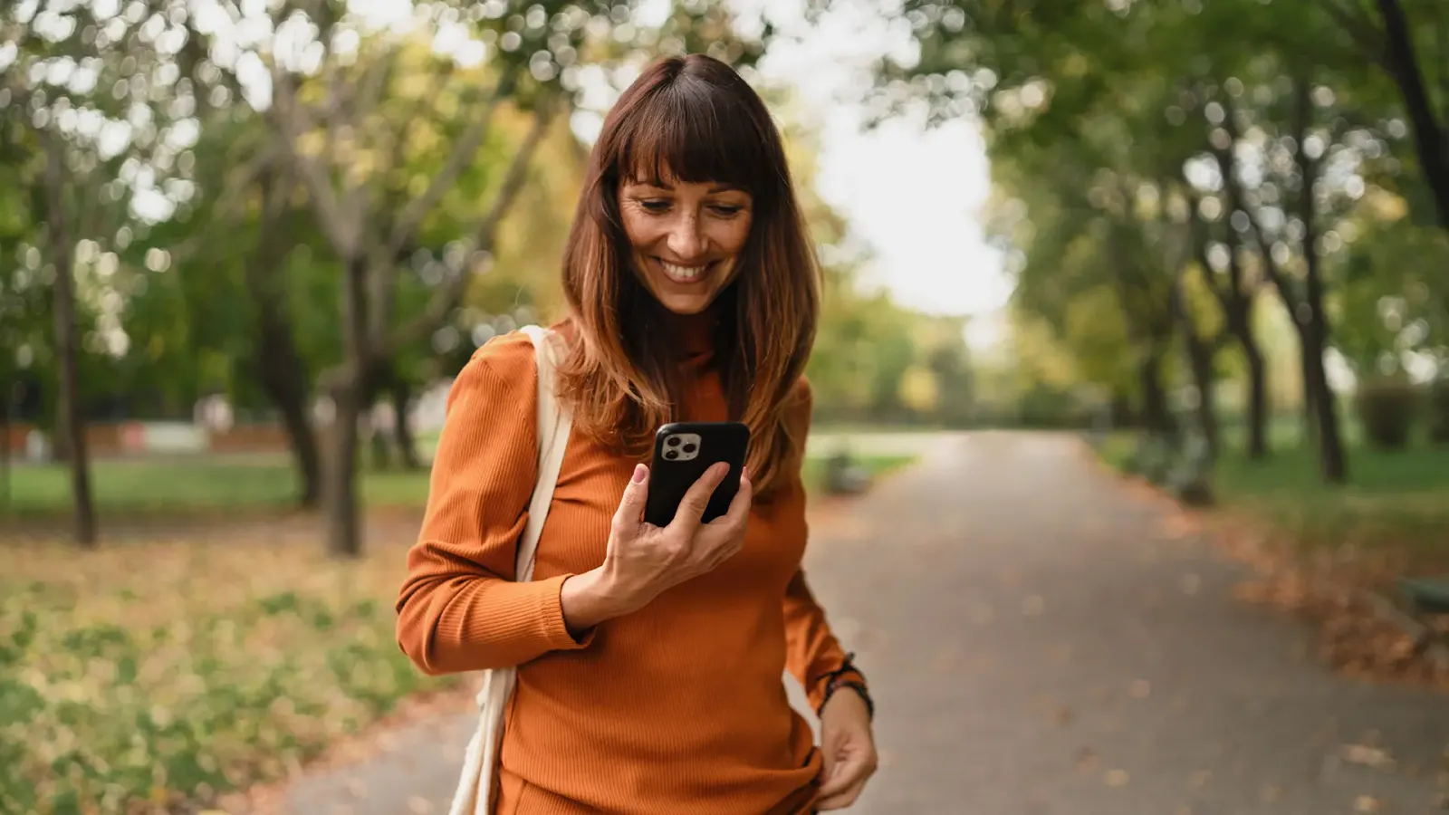 woman outdoors on mobile phone